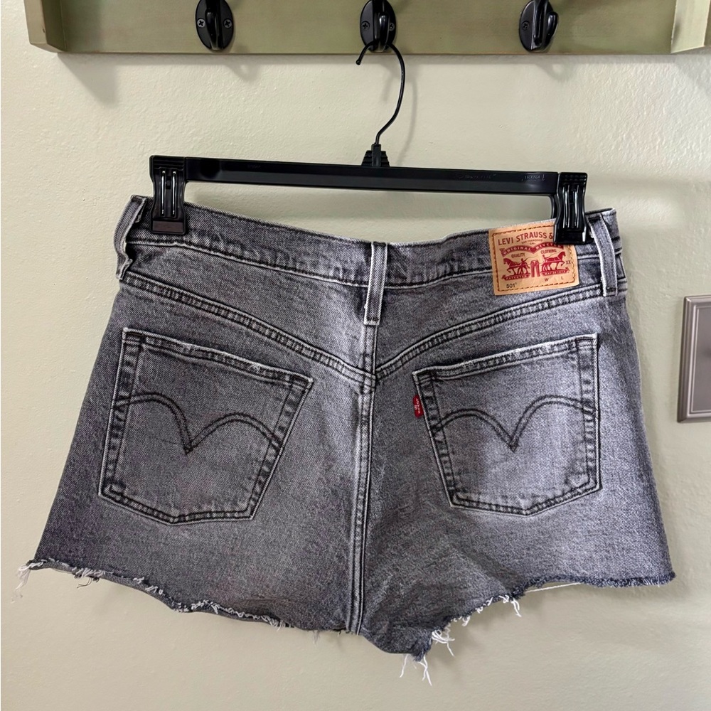 Levi's Gray Jean Shorts with Raw Hem and Button Fly.